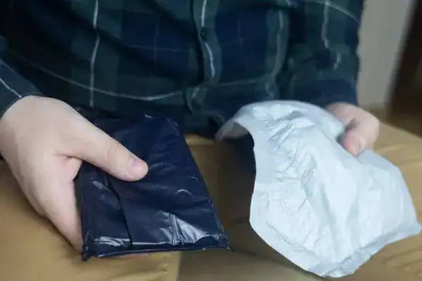 image of man holding stool incontinence Huddersfield products